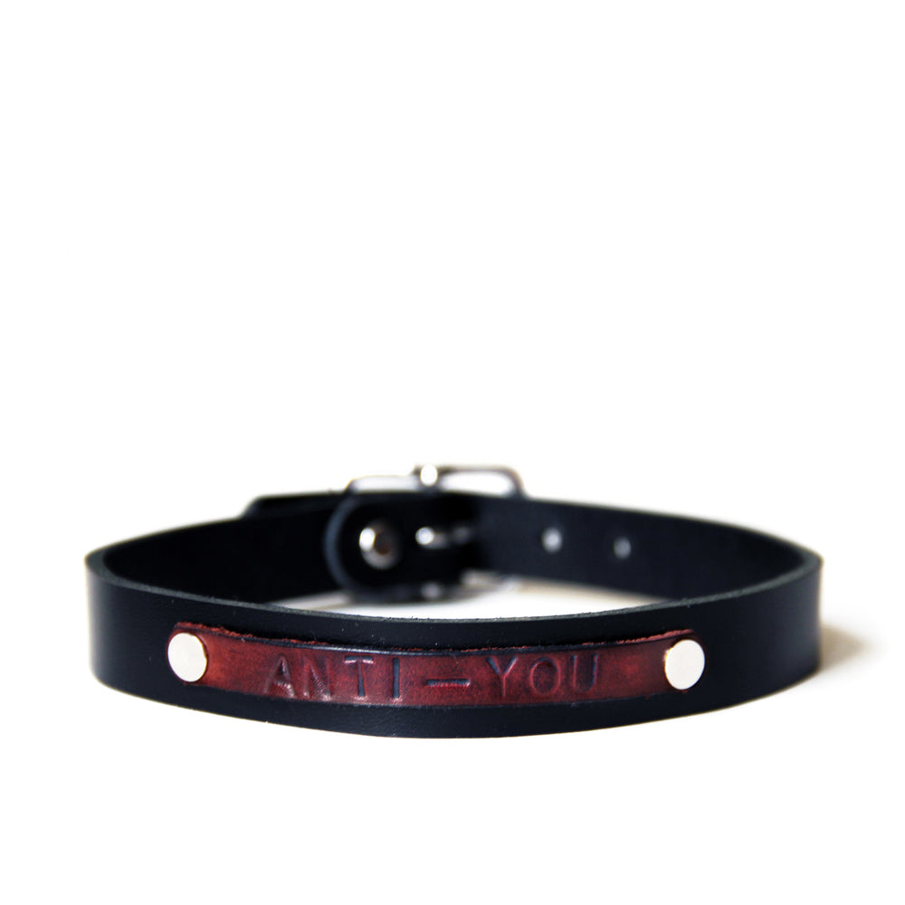Anti-You choker front view. Black choker with dark red anti-you plate