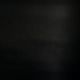 Swatch of faux leather. Leather grain texture is visible in this black faux leather.
