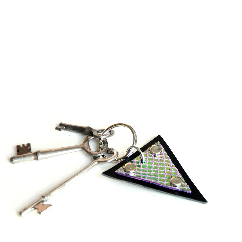 Trianthem keychain, mermaid triangle leather shown with skeleton keys and angled to show color change