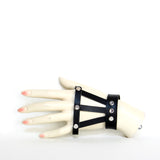 Top view of black leather hand harness on mannequin