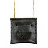 Black leather envelope pendent necklace, close up view