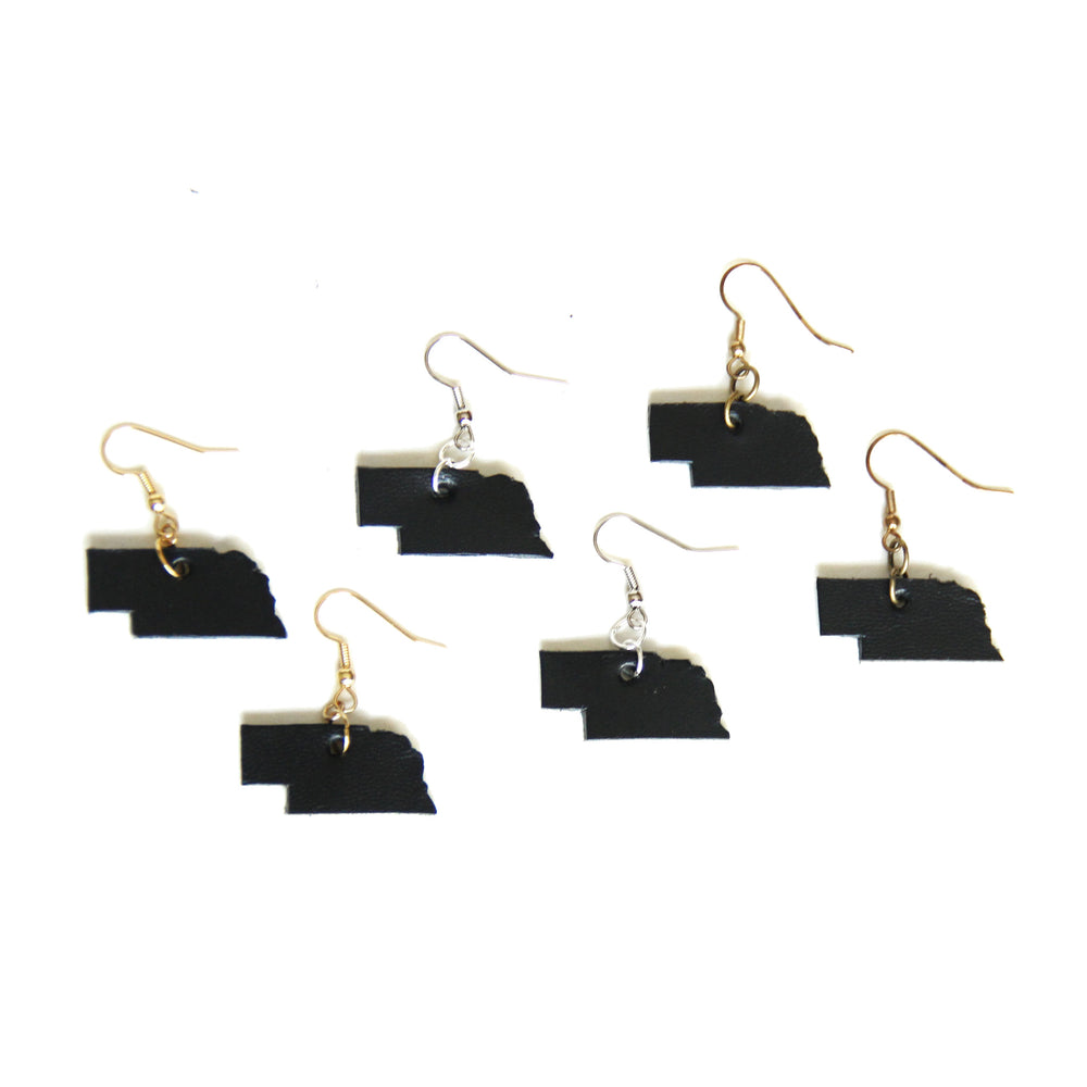 Group of black Nebraska shaped leather earrings