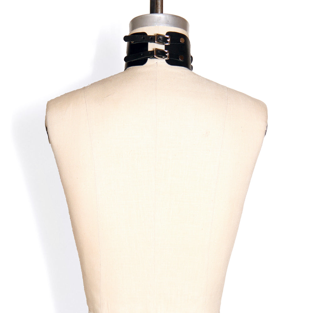 Back of dressform wearing a Laced Front Choker. The double straps in the back are shown with their small buckles.