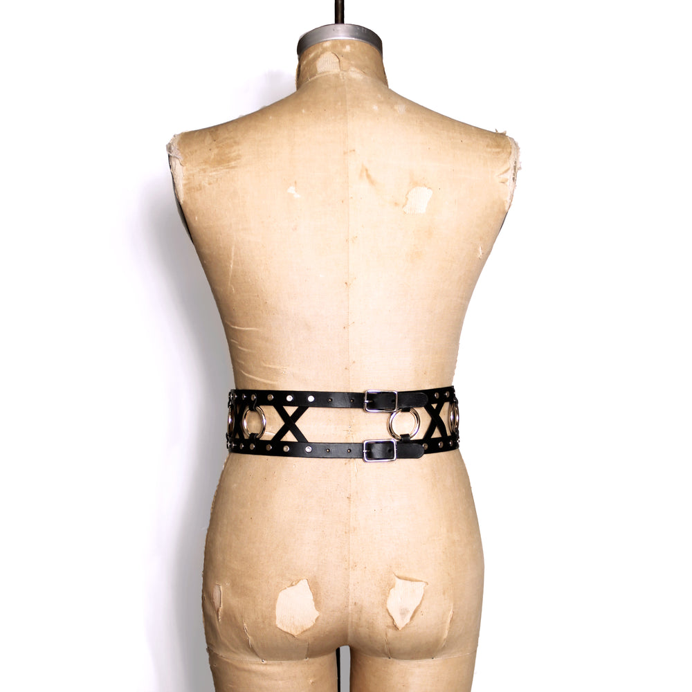 Back of belt showing the double buckle that can be worn in the front or the back. Here the buckles are shown worn on the back of the waist of a dress form.