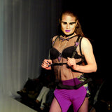 Model wearing half suspender harness with mermaid leather