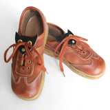 Cat face shoe plates, angled front view on shoes