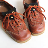 Cat face shoe plates, close up view