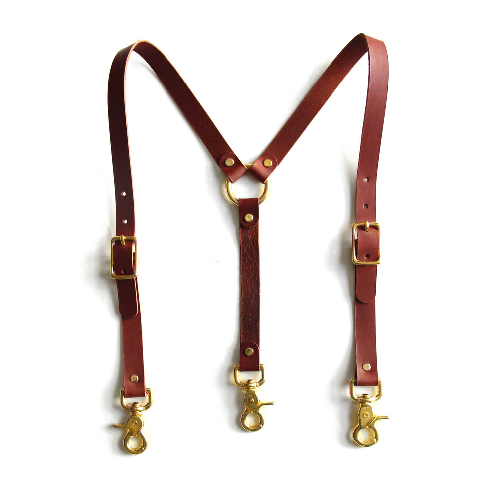 Chestnut brown leather high-waisted suspenders, with swivel trigger clips and brass hardware