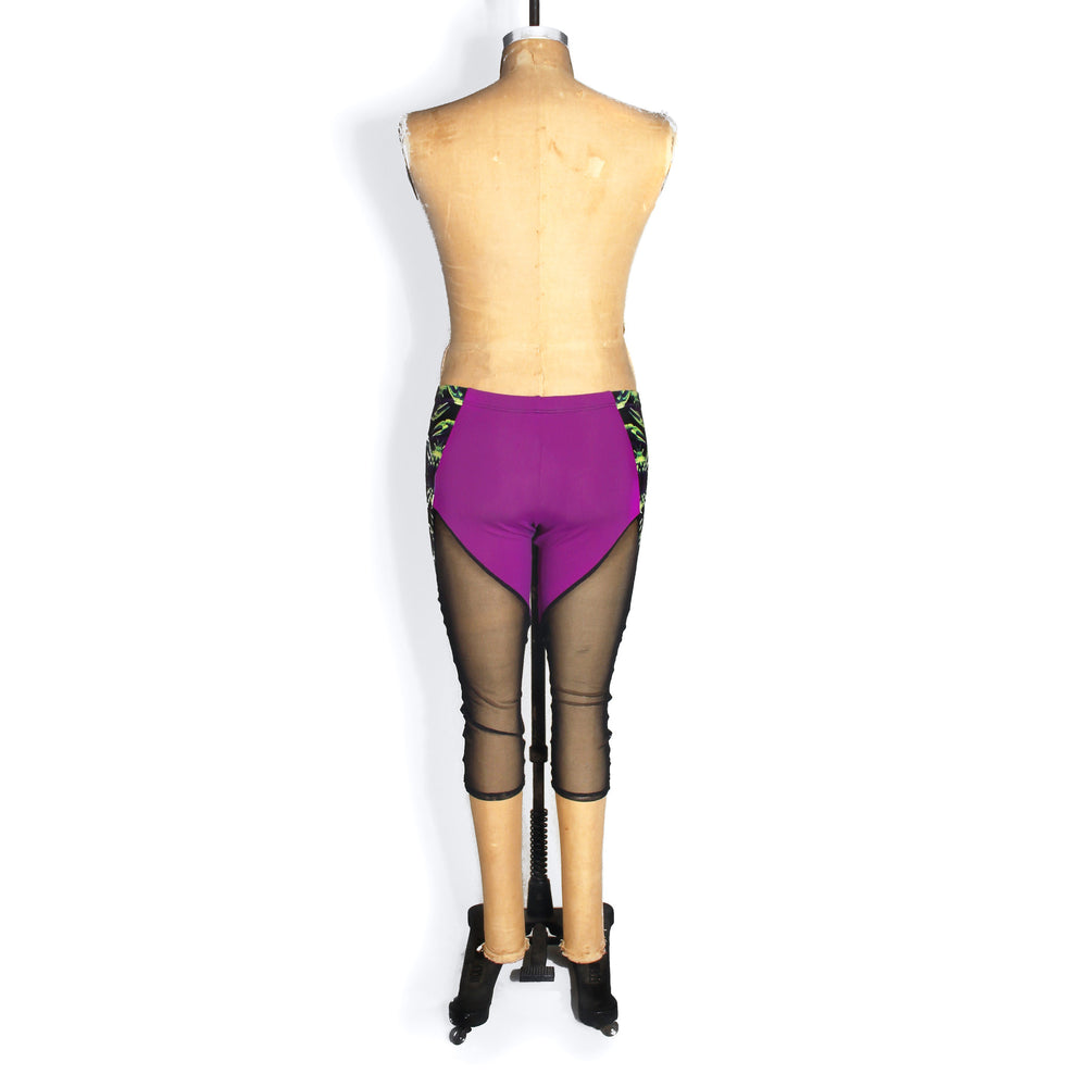 Colorblocked mesh capri leggings, purple and black mesh, back view