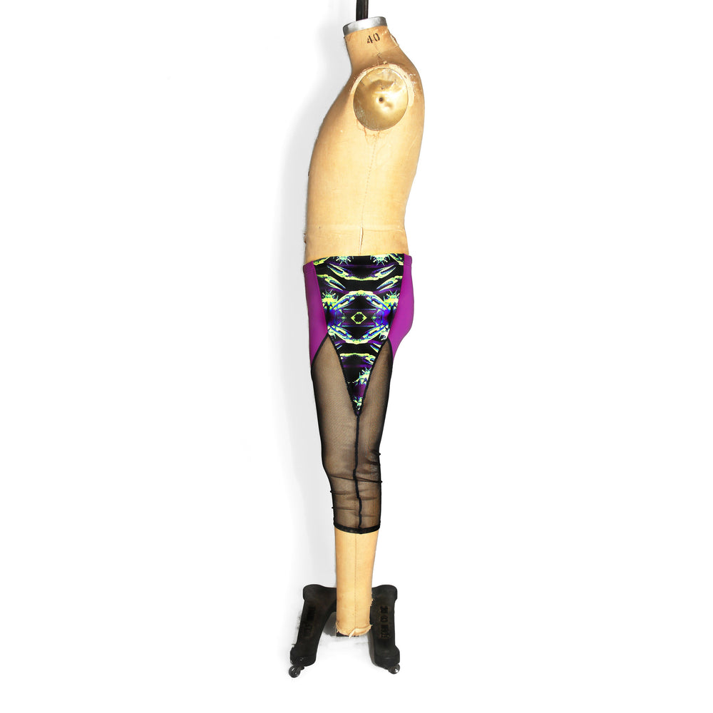 Colorblocked mesh capri leggings, purple and black mesh, side view