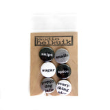 Pin set in the black/white/grey color way which includes black, white and grey pins. Shown in branded packaging.