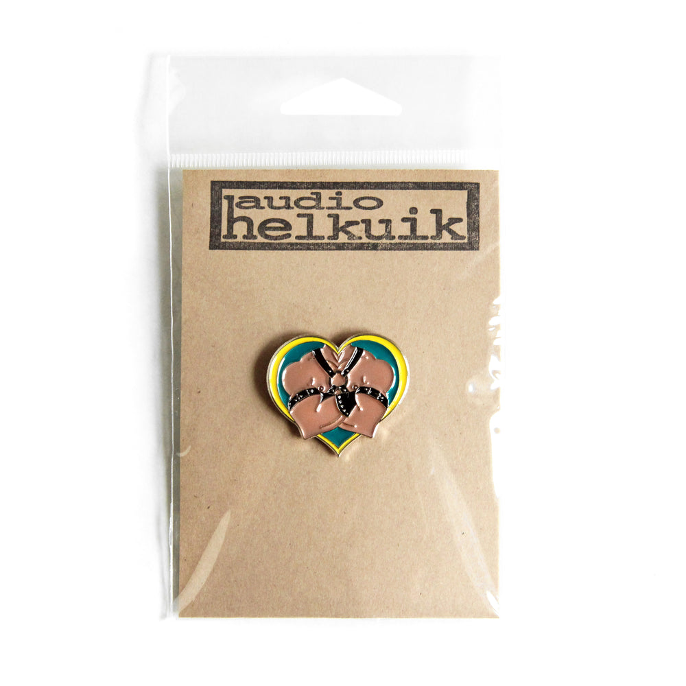 Enamel leather daddy pin shown in branded packaging.