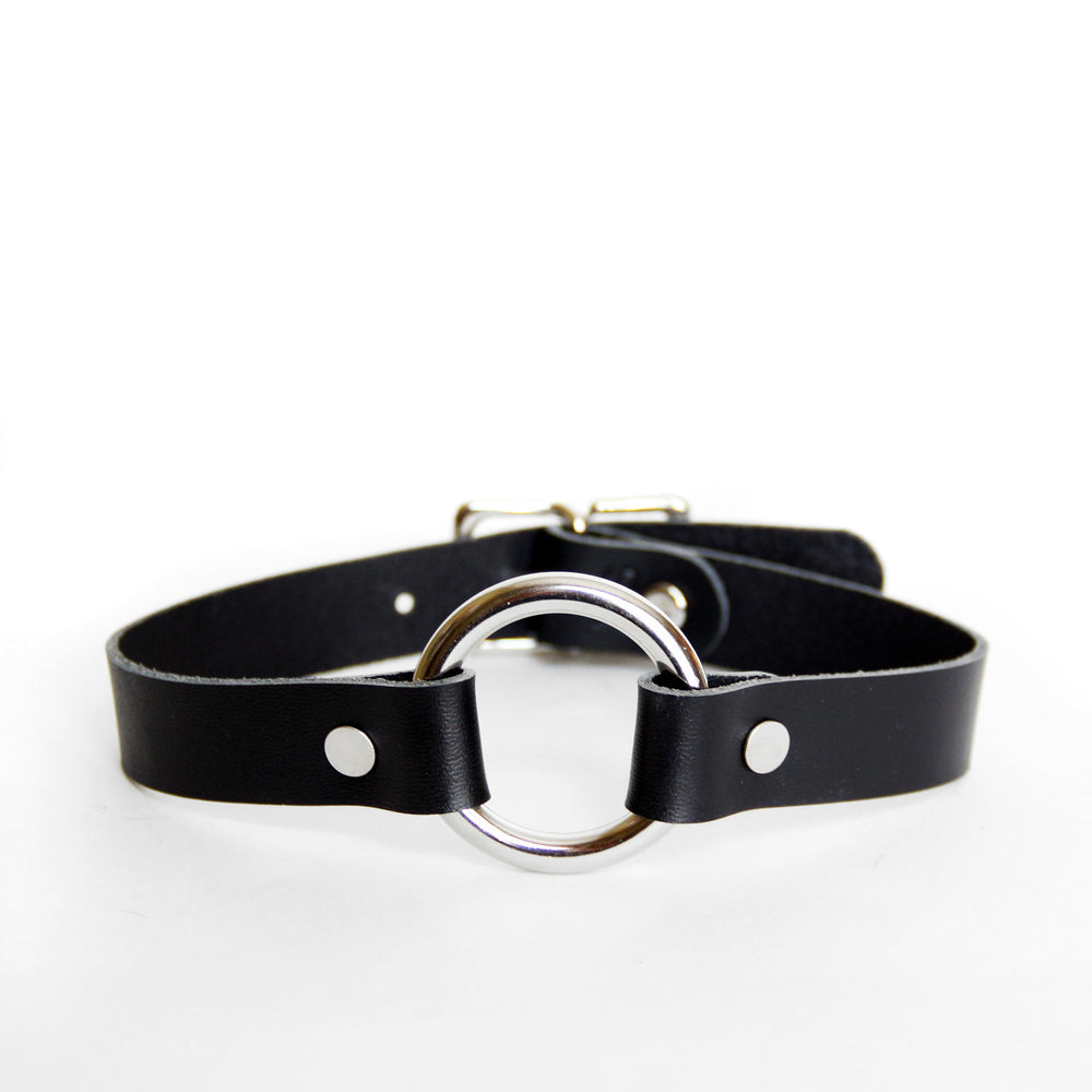 Classic black leather choker with silver o-ring and hardware. Shown on a white background.