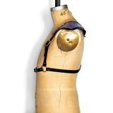 Black leather half suspender harness with silver hardware and mermaid leather triangle sholders, side view