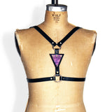 Black leather harness with purple mermaid leather triangle in the center, front view